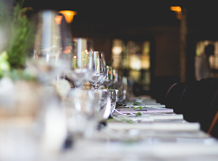 A table in a restaurant with glasses.